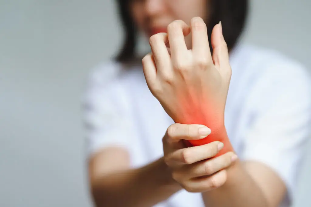 Chronic Fatigue Syndrome - A woman has pain in her wrist