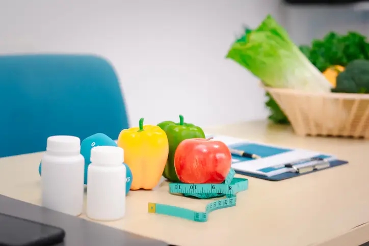 nutrition table with supplements, veggies, fruits